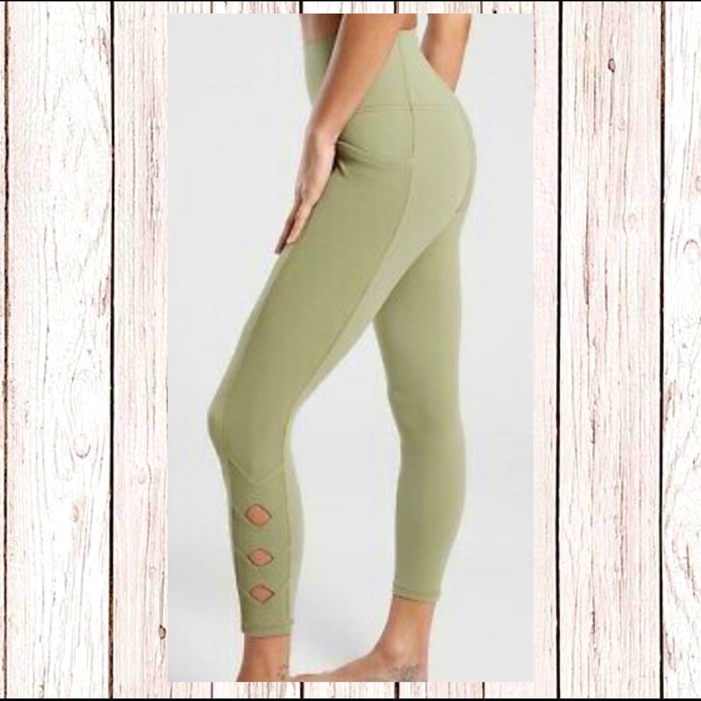 athleta salutation stash pocket II cutout tight 7/8 NWOT. Eucalyptus olive